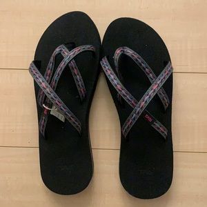 Brand new teva flip flops black w pink and blue stitching